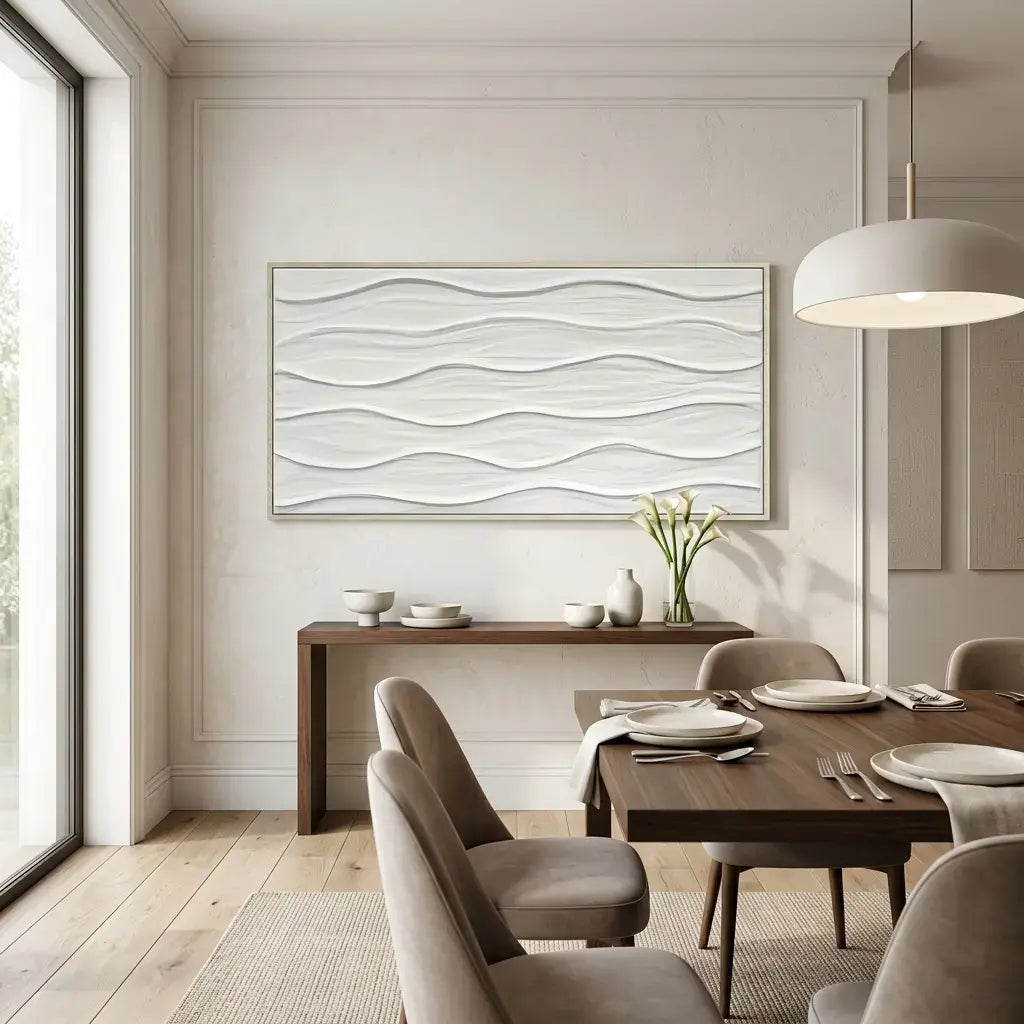 Dining room with a wooden table set for dinner, framed artwork on the wall, and natural light coming through a window.