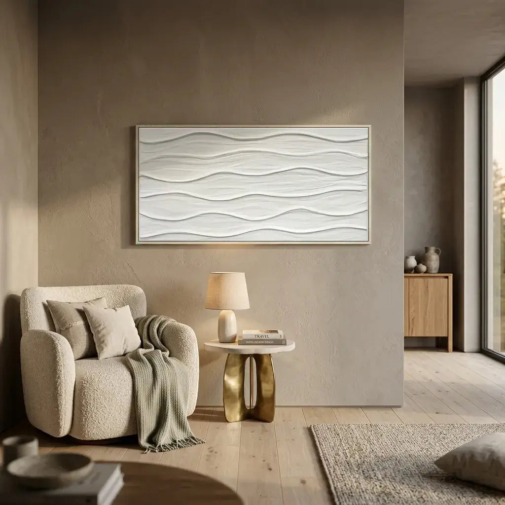 Modern living room with a textured wall art piece, armchair, and side table.