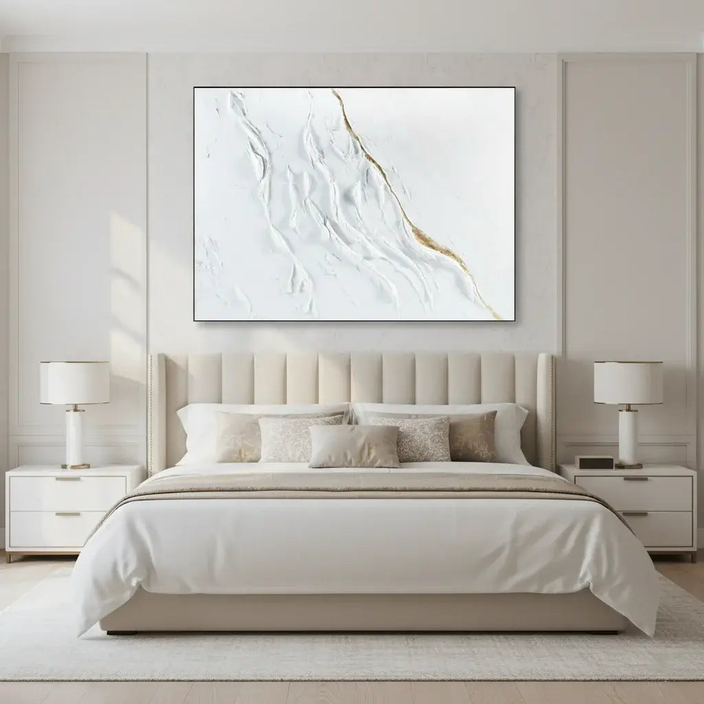 Modern bedroom with a bed, nightstands, and abstract wall art.
