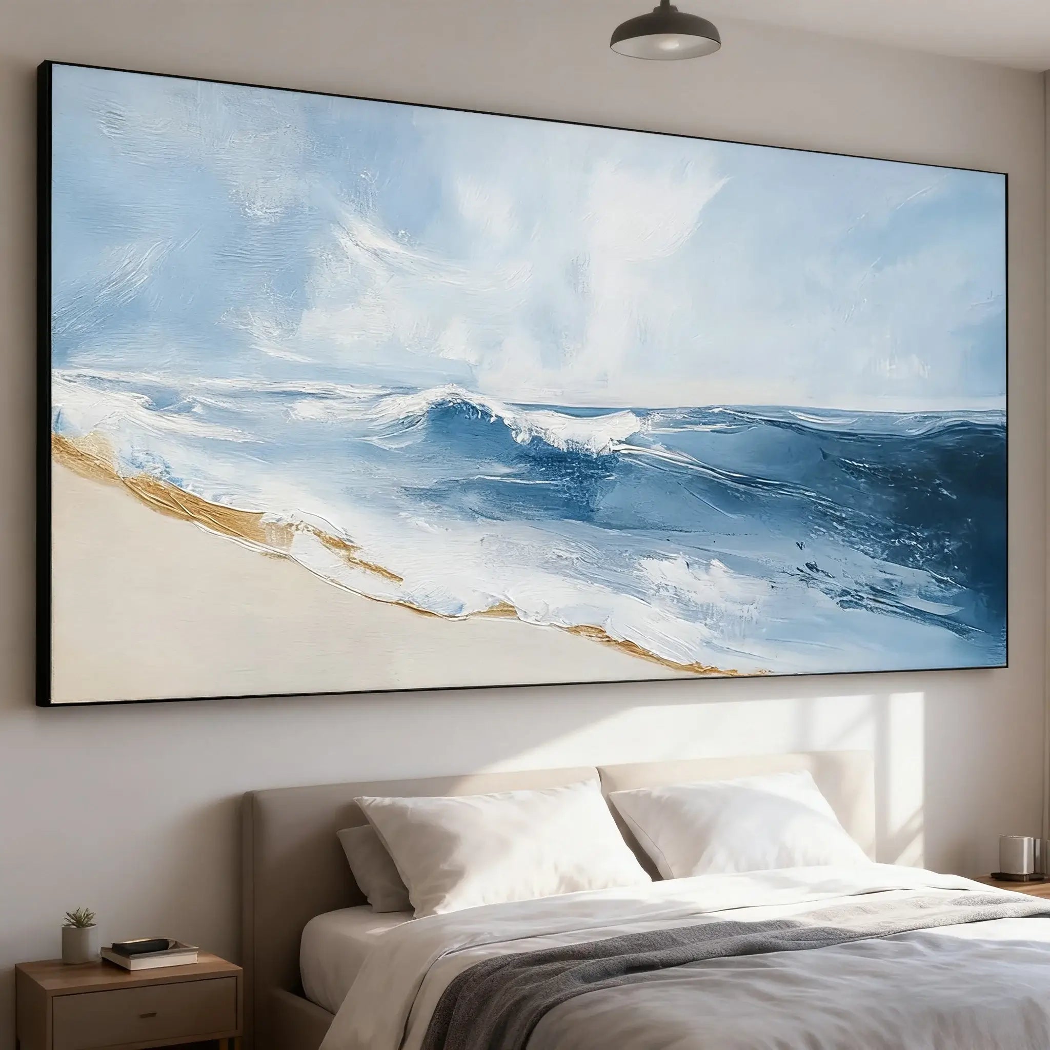 Large ocean painting on a wall above a bed in a bedroom