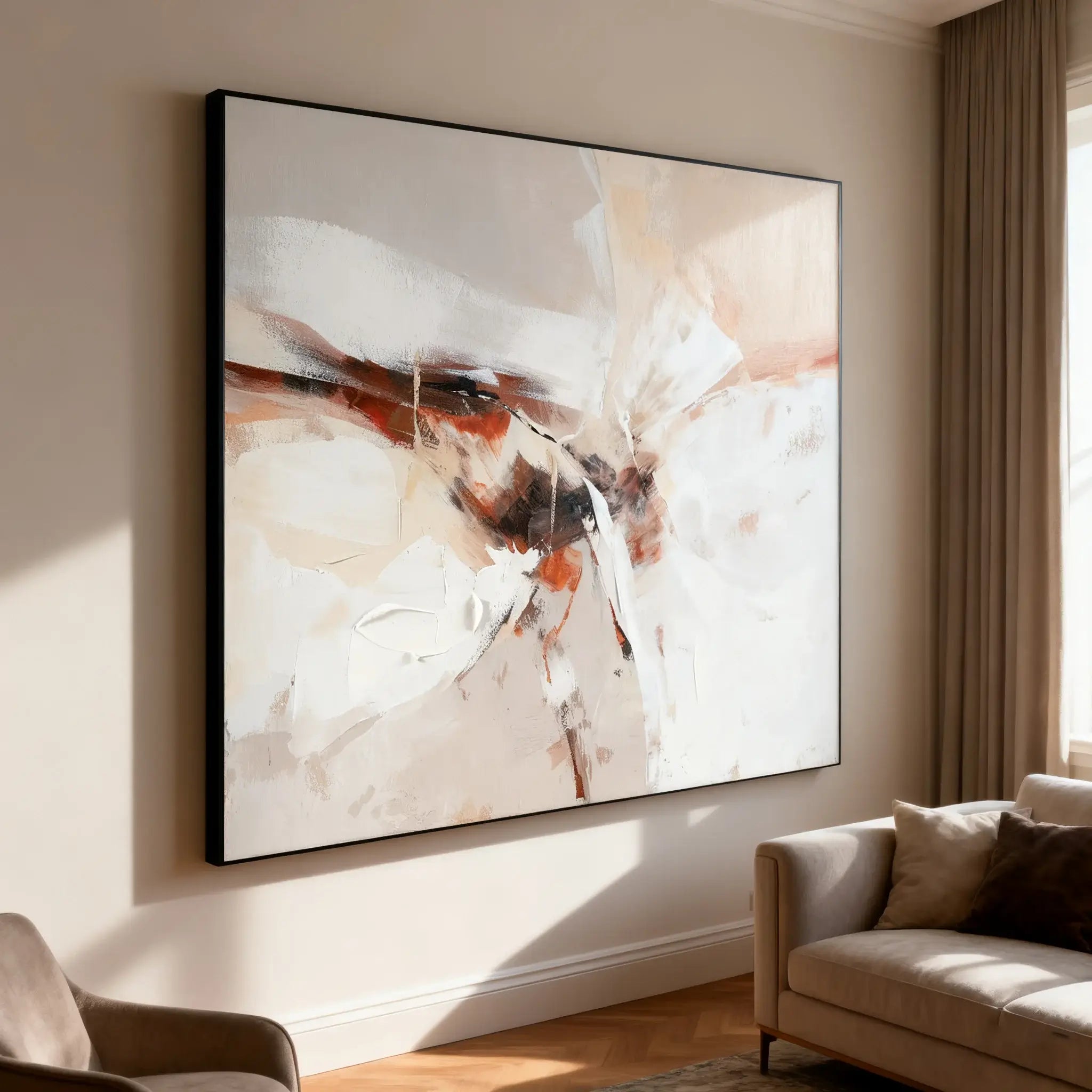 Abstract painting on a wall in a living room with a sofa and chair.