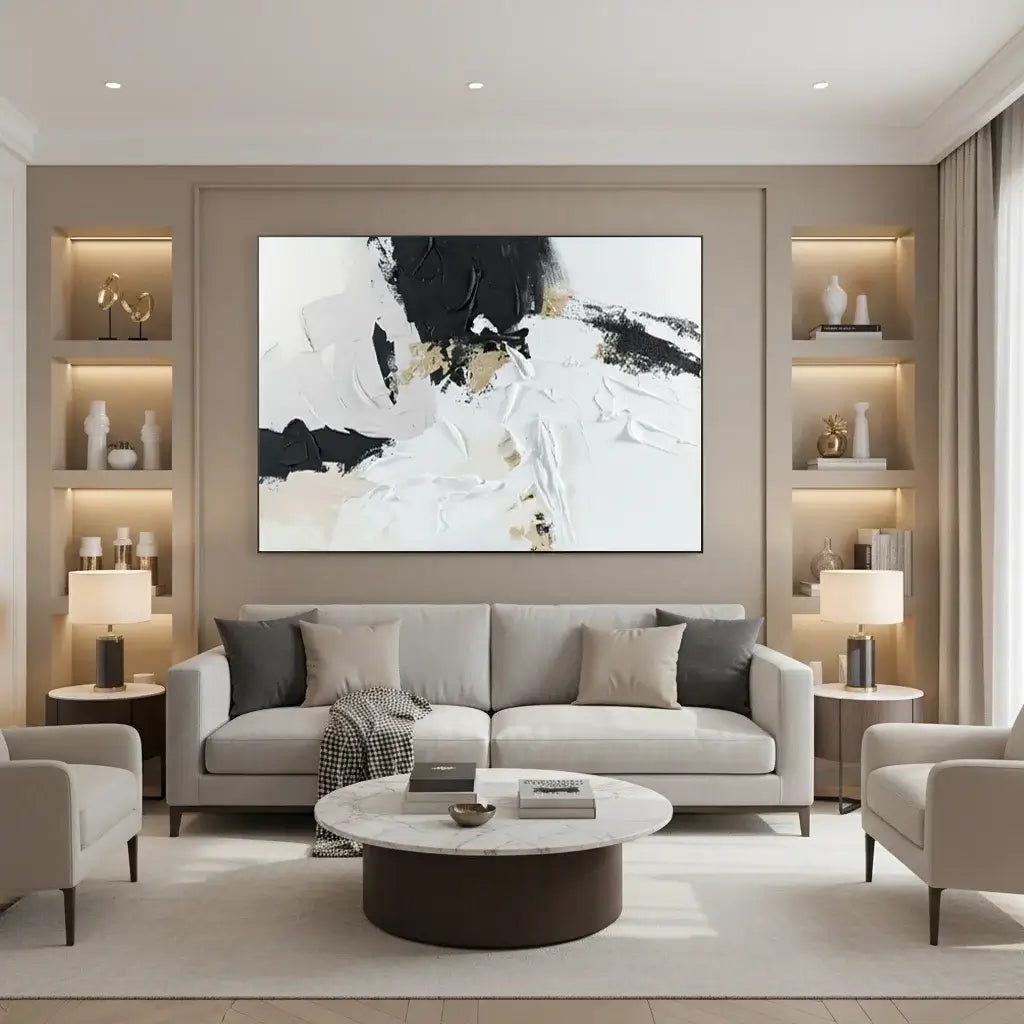 Modern living room with a gray sofa, round coffee table, and abstract artwork on the wall.