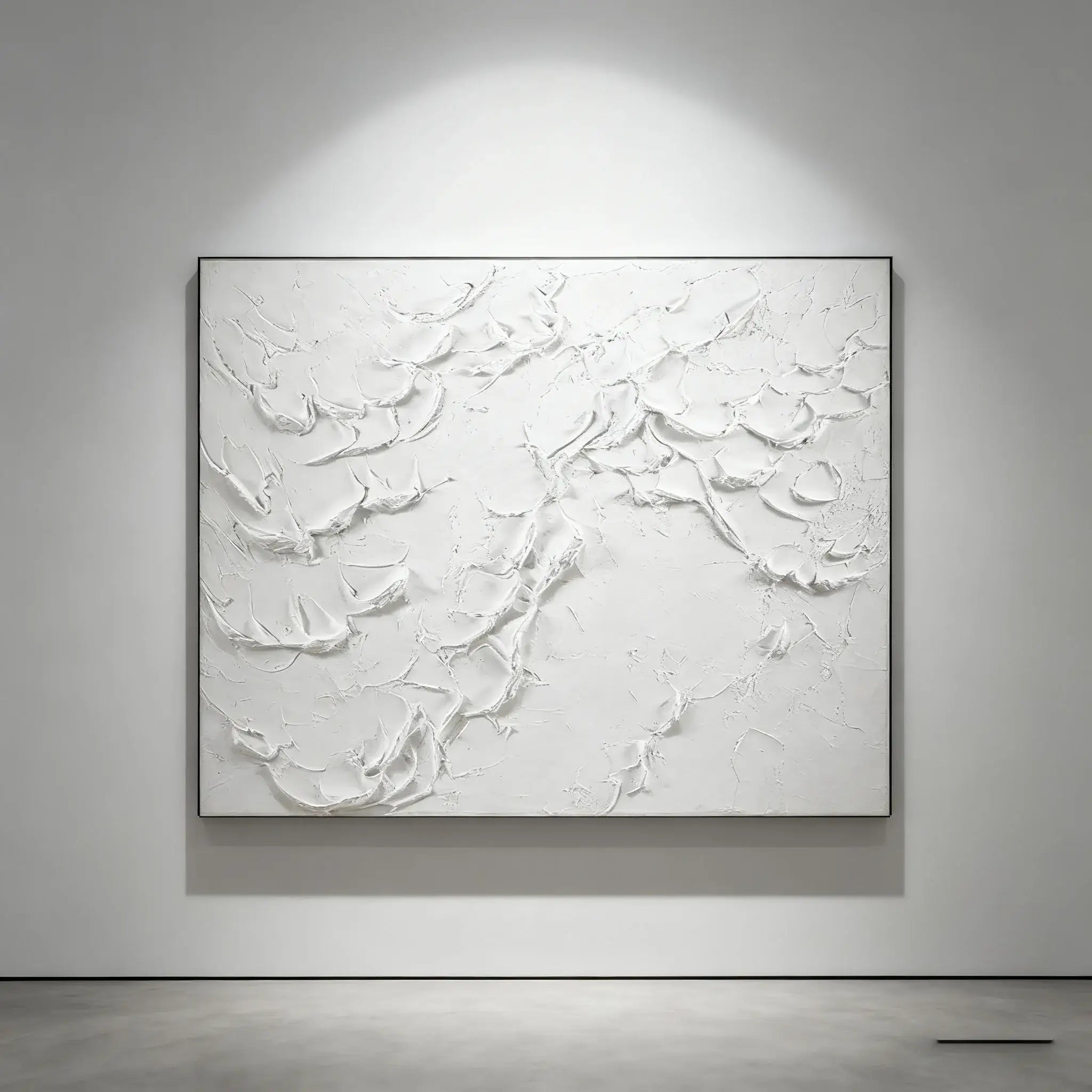 Abstract white painting on a gray wall