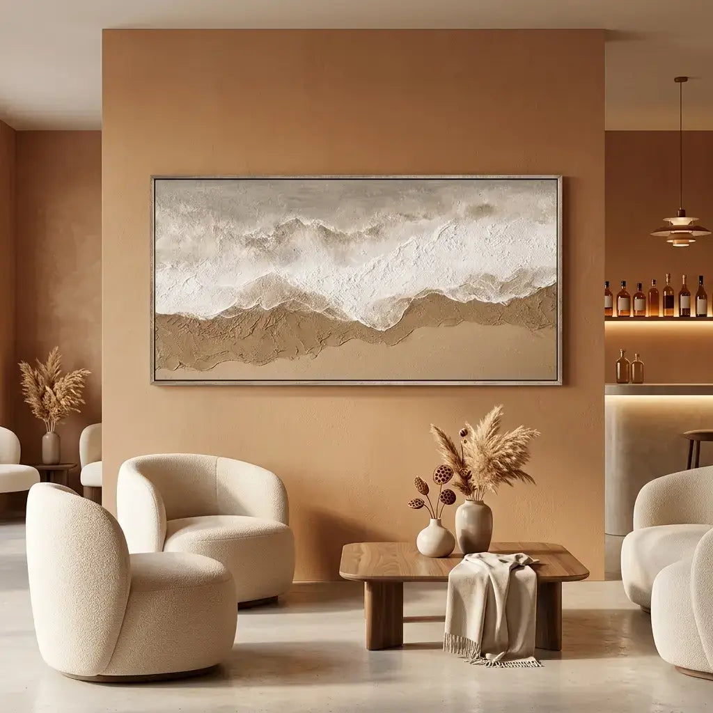 Modern living room with beige walls, white chairs, a wooden coffee table, and decorative elements.