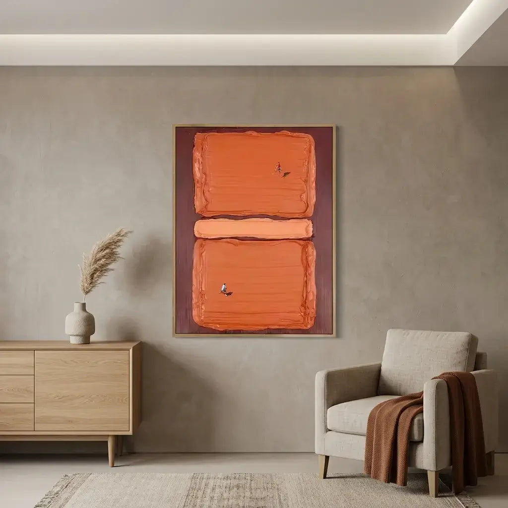 Modern interior with abstract orange artwork on a gray wall, wooden sideboard, and armchair.