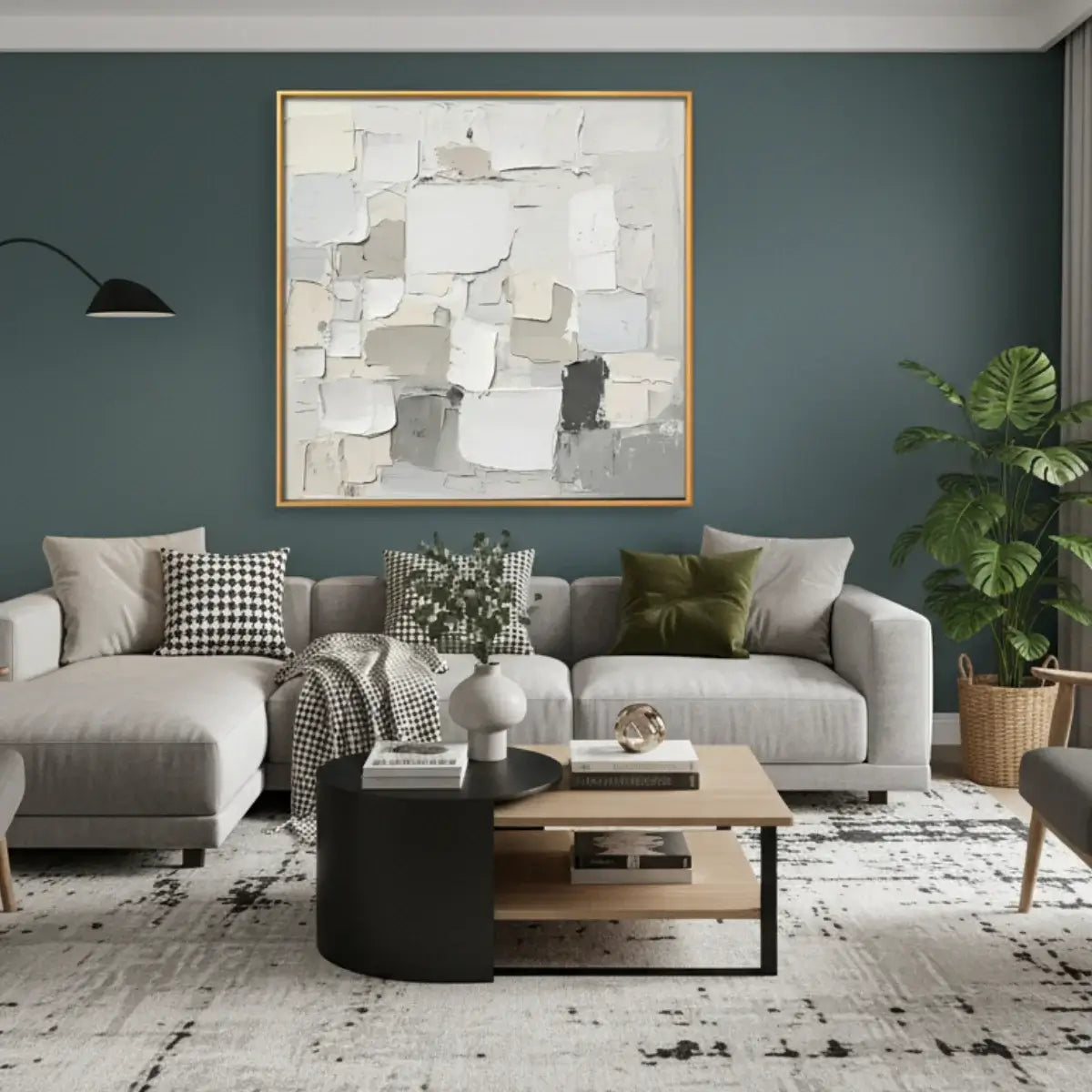 Modern living room with a gray sofa, abstract art, and decorative items.