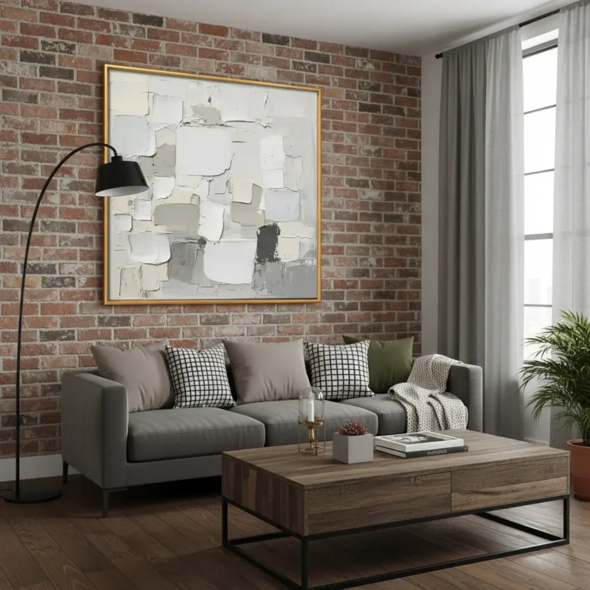 Living room with gray sofa, wooden coffee table, and abstract art on brick wall.