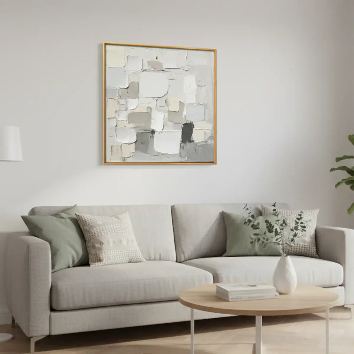 Living room with a gray sofa, coffee table, and abstract art on the wall.