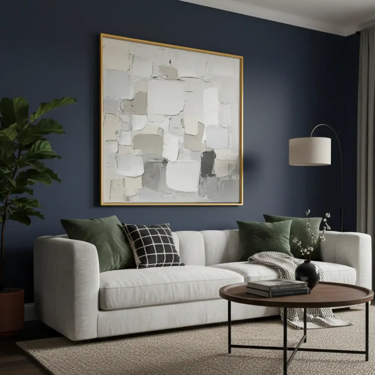 Modern living room with a white sofa, abstract art, and decorative items.