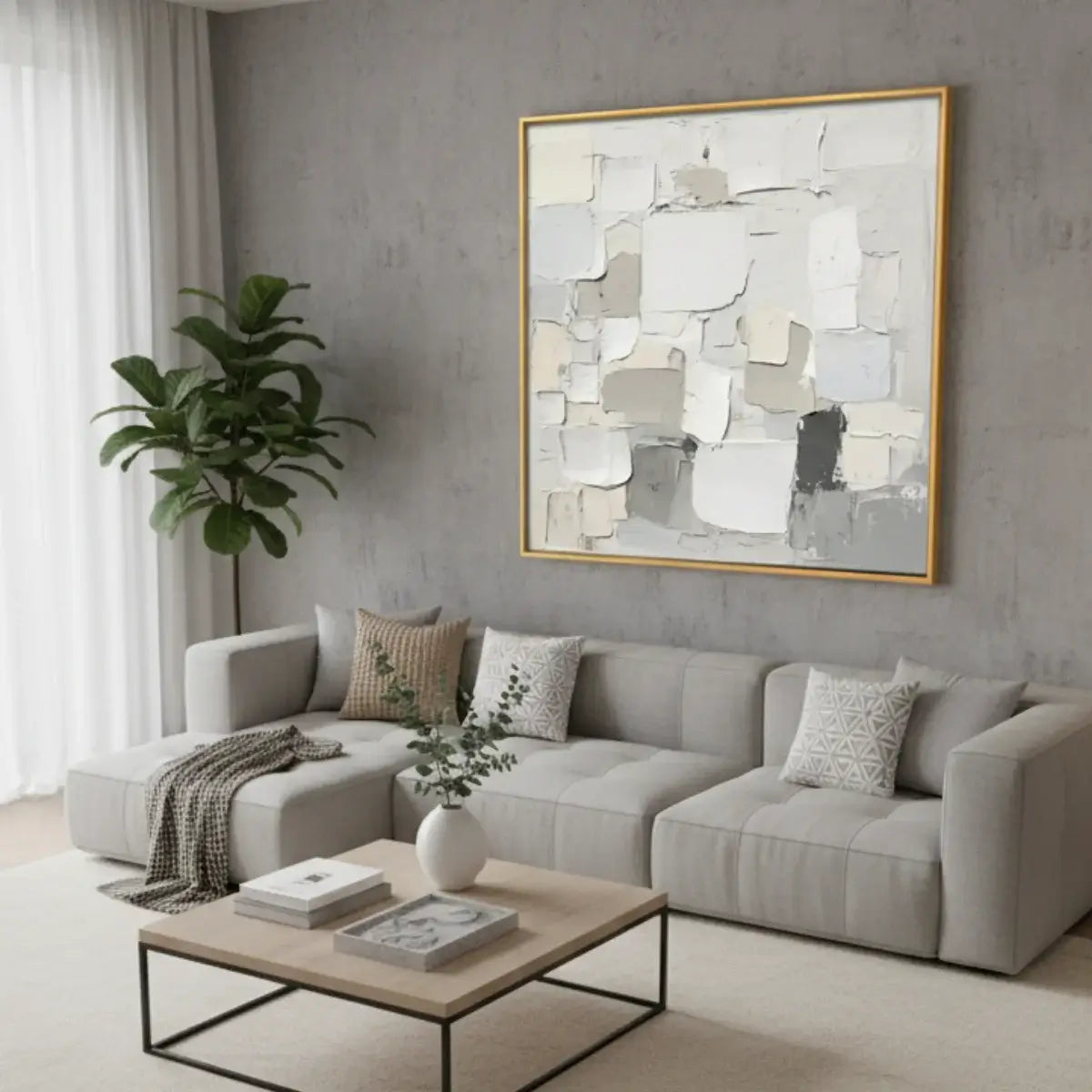 Modern living room with a gray sectional sofa, abstract art, and decorative elements.