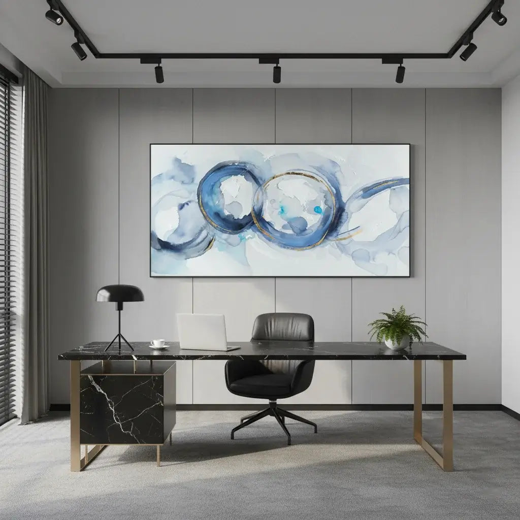 Modern office setup with a black marble desk, chair, and abstract wall art.