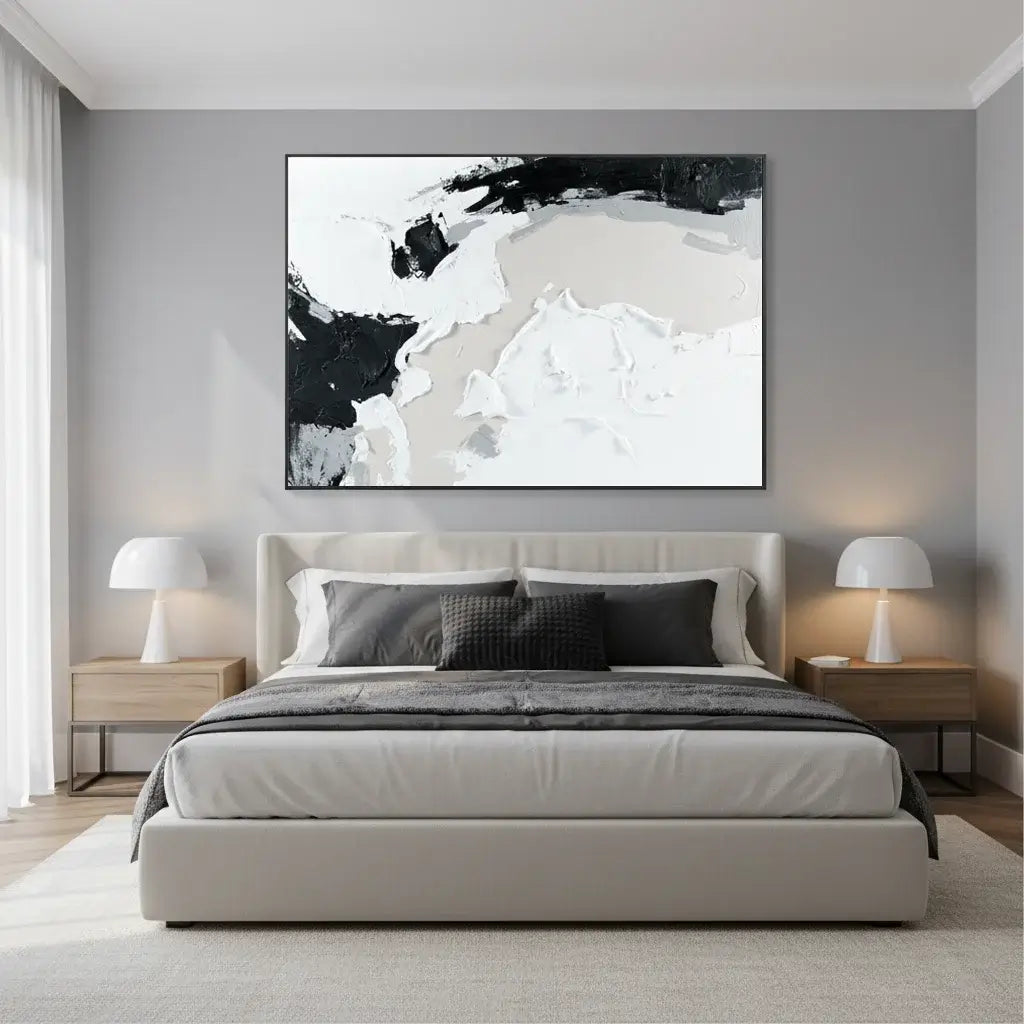 Modern bedroom with a bed, nightstands, and abstract wall art.