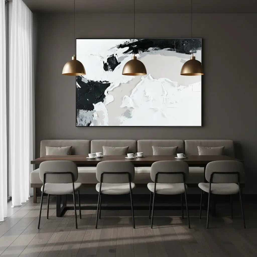 Modern dining room with abstract art on the wall, gray sofa, and chairs.