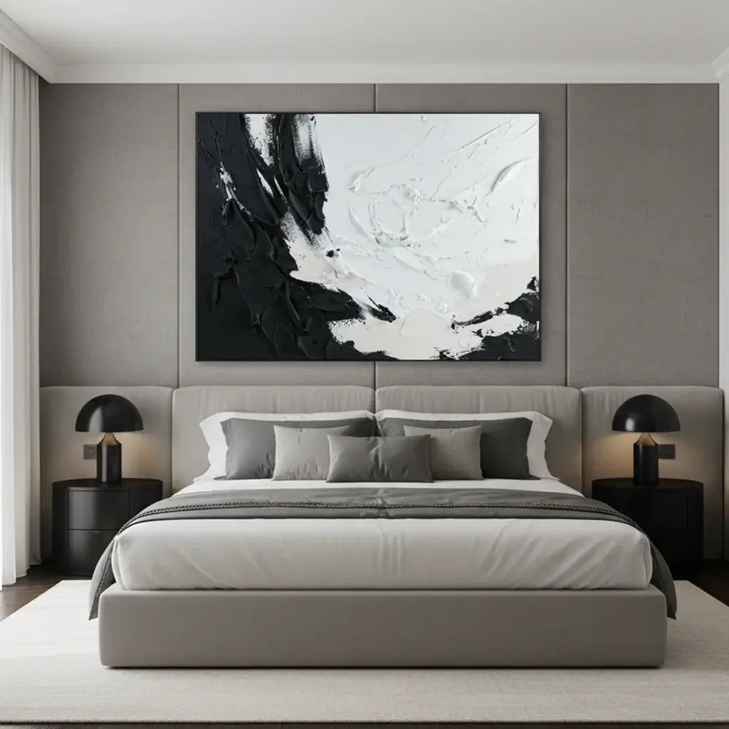 Modern bedroom with a gray bed, abstract painting, and side tables.