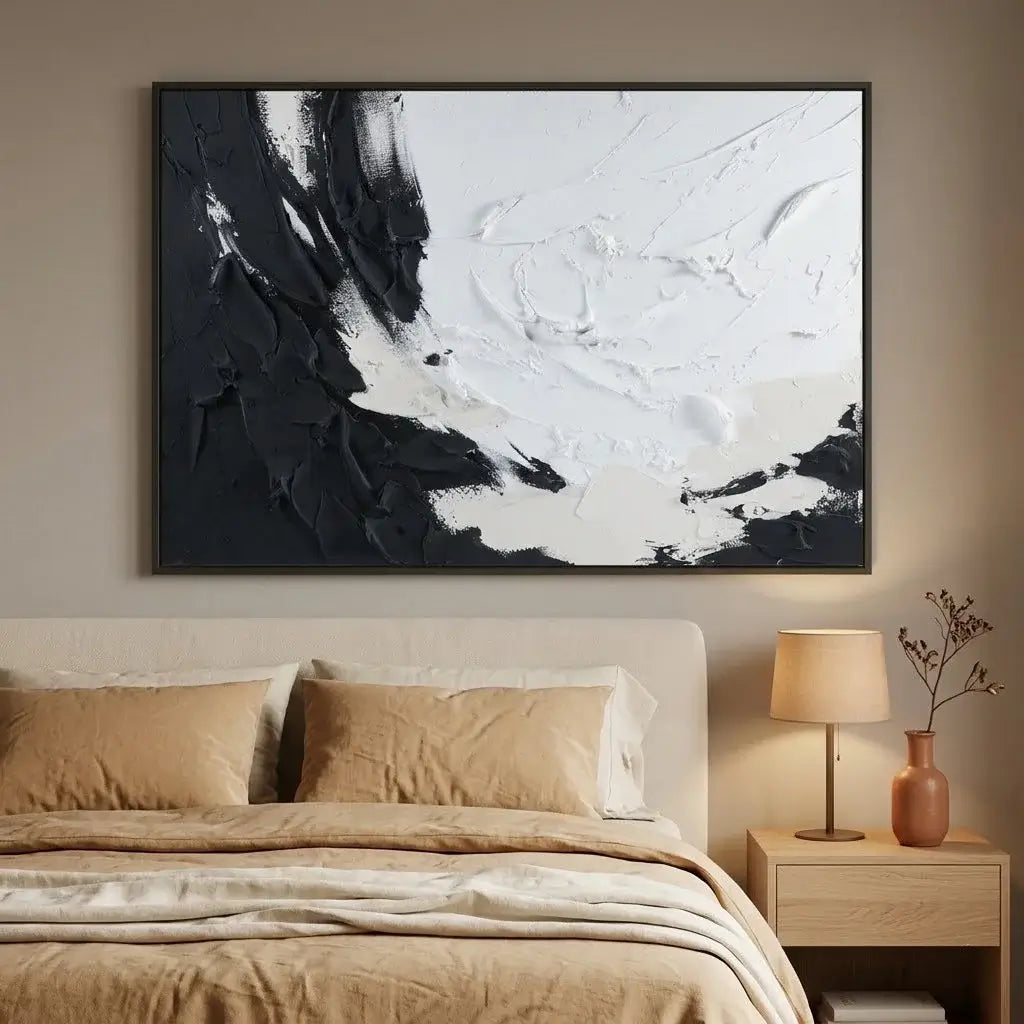 Modern bedroom with a gray bed, abstract painting, and side tables.