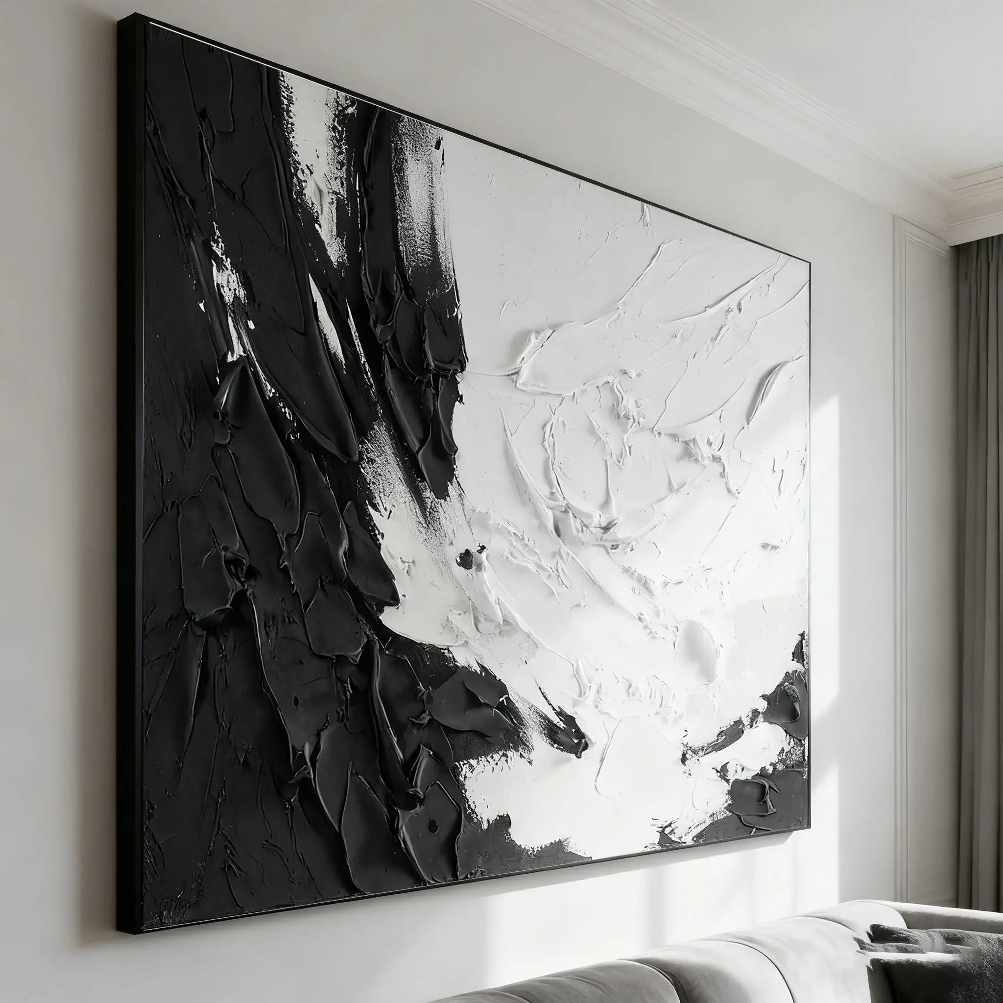 Abstract black and white painting on a wall in a modern interior setting.