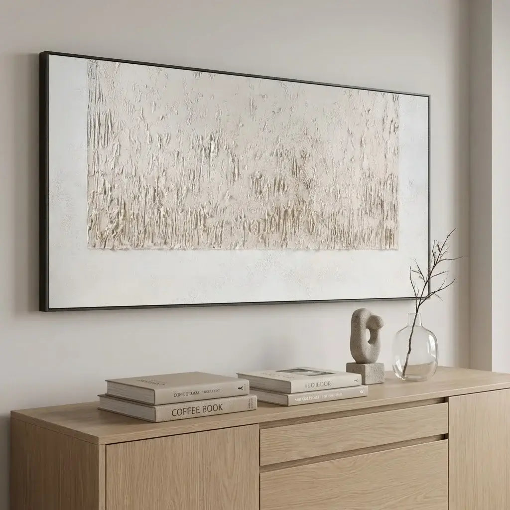 Abstract painting on a wall above a wooden console table with decorative items.
