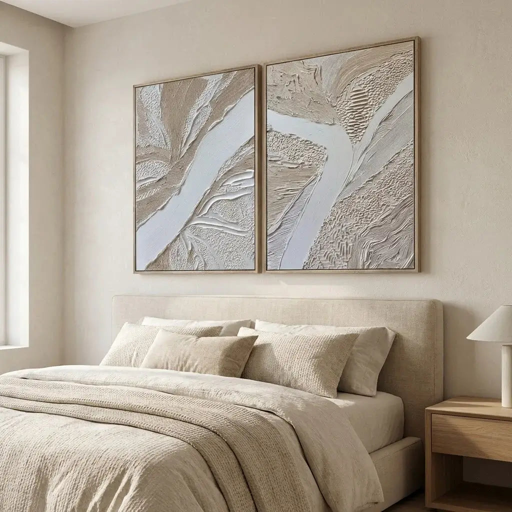 Beige bedroom with abstract wall art and a bed.