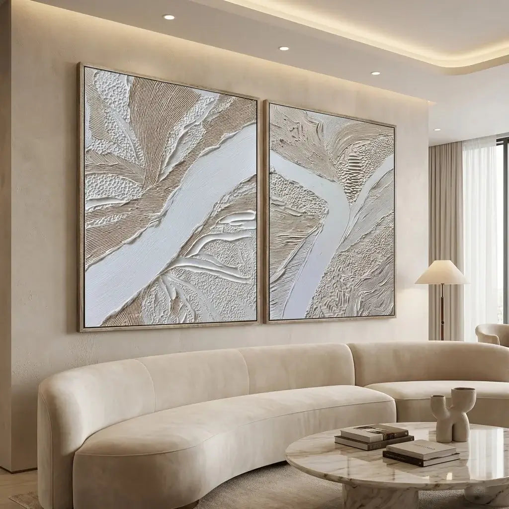 Modern living room with abstract wall art and a beige sofa.