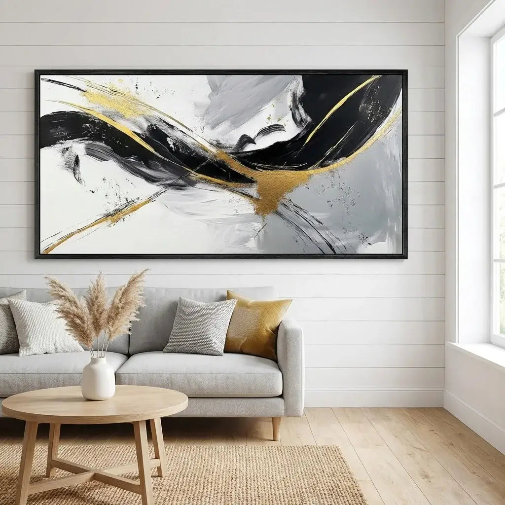 Living room with a gray sofa, wooden coffee table, and abstract painting on the wall.