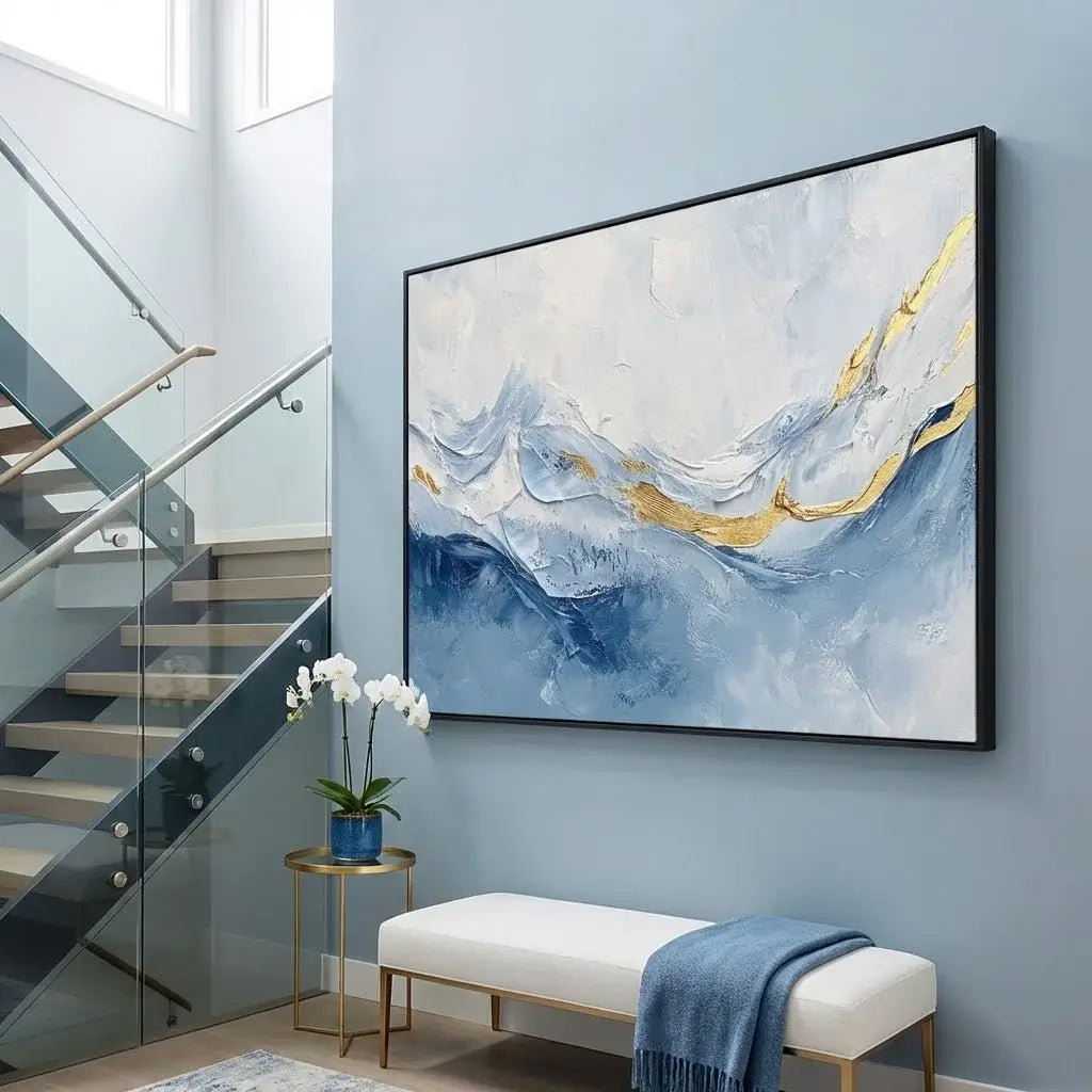 Abstract painting in a modern interior setting with a staircase and bench.
