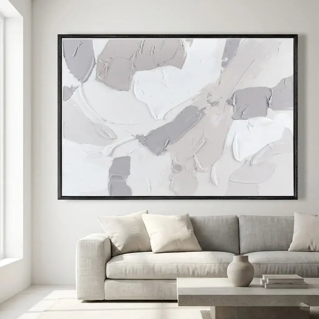 Abstract art piece in a modern living room with a sofa and coffee table.