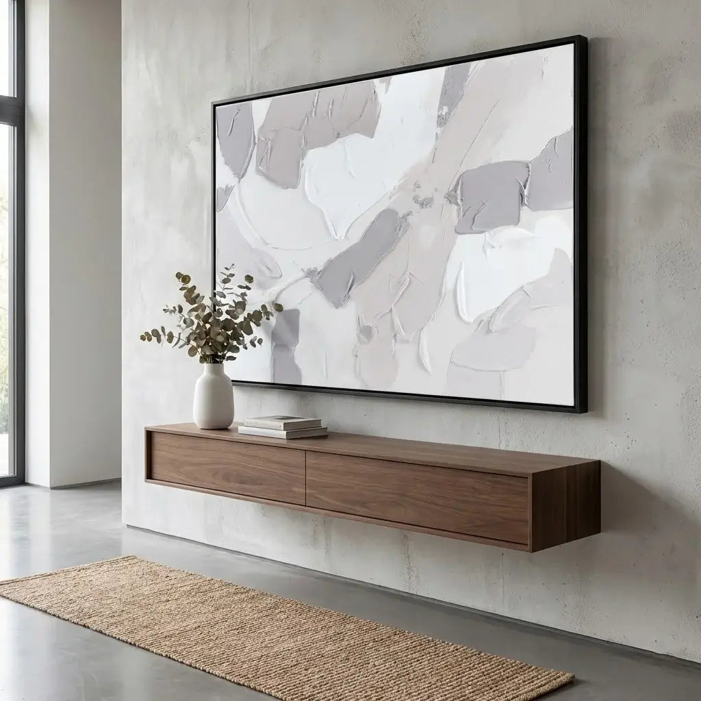 Modern living room with a wooden TV stand and abstract painting on the wall.
