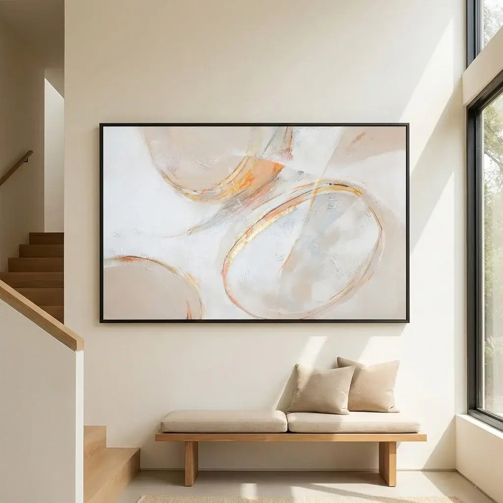 Abstract art piece in a modern interior setting with a bench and staircase.