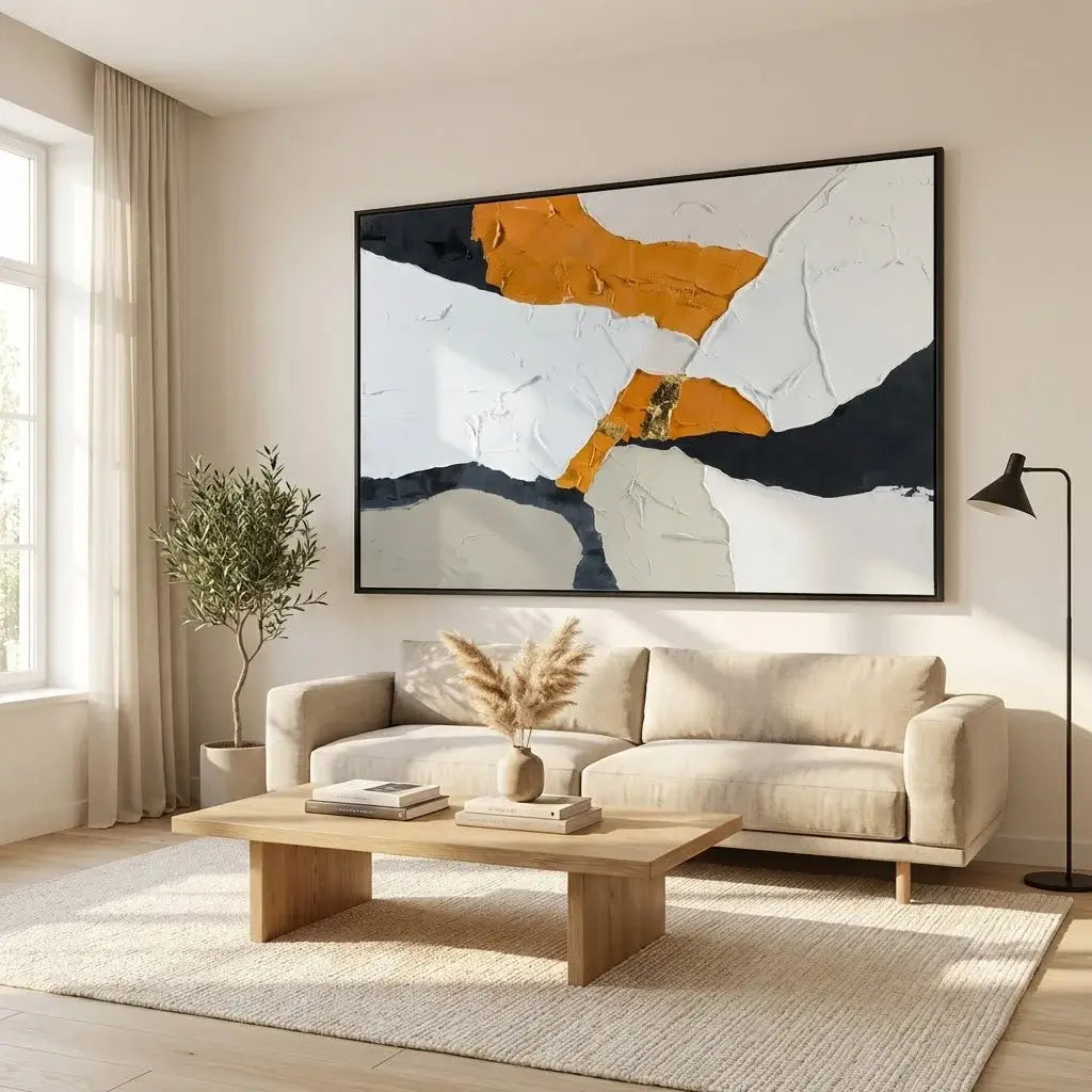 Modern living room with a beige sofa, wooden coffee table, and abstract art on the wall.