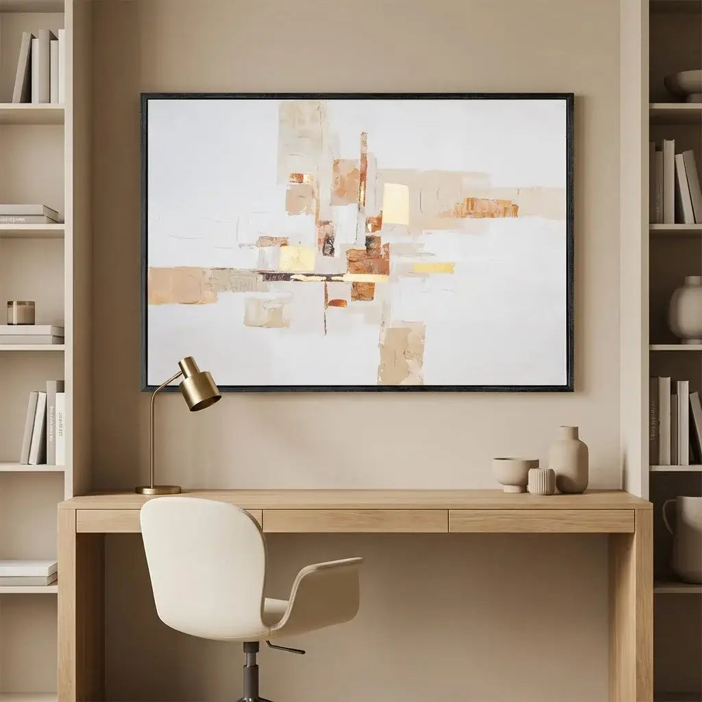 Modern home office with a desk, chair, and abstract art on the wall.