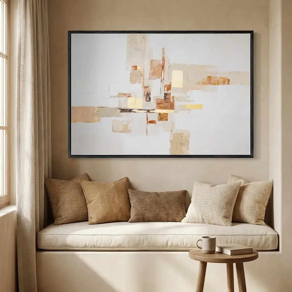 Modern living room with a beige sofa, decorative pillows, and a abstract painting on the wall.