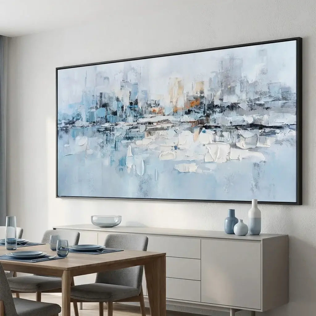 Abstract cityscape painting on a wall above a dining table