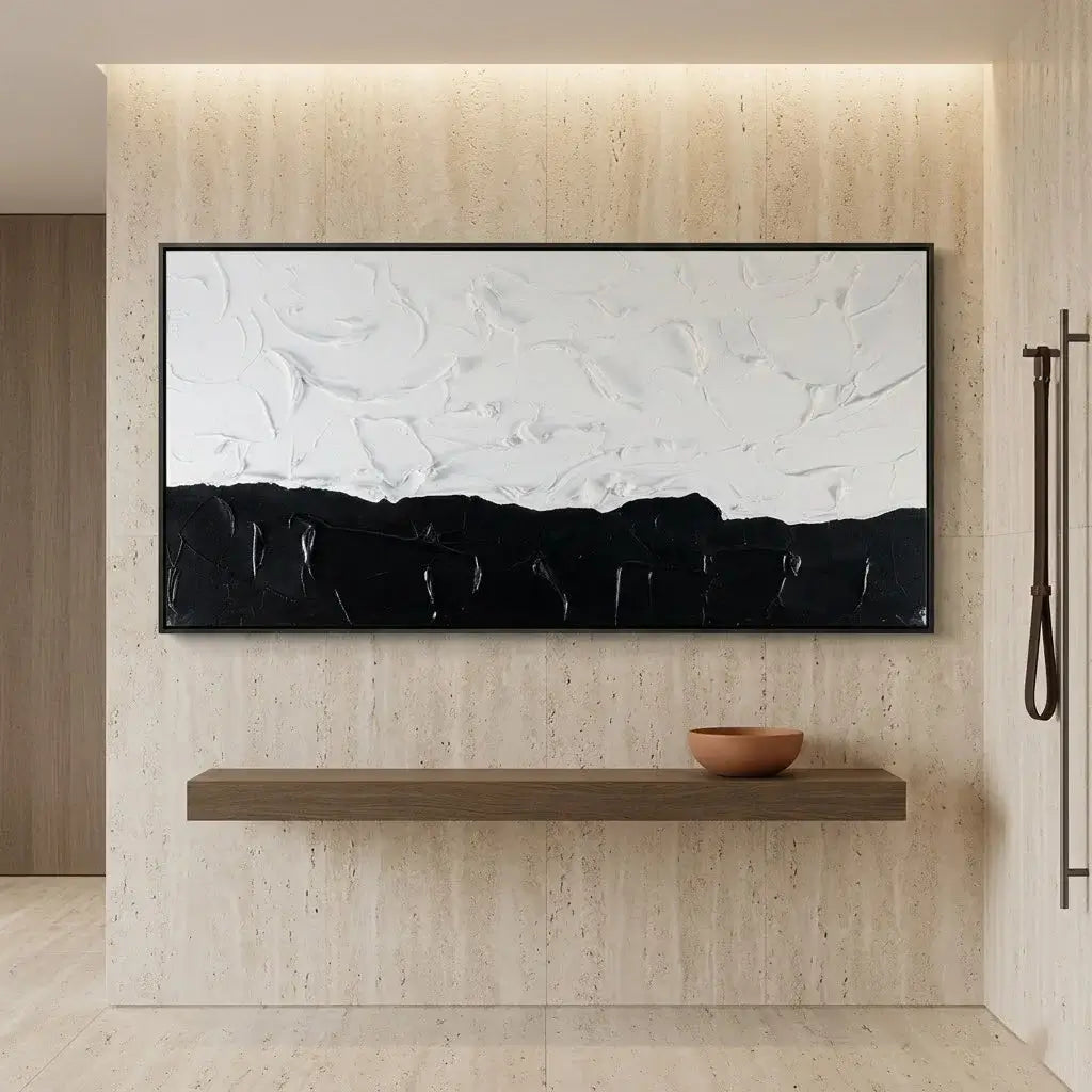 Modern office setup with a black desk, chair, and abstract artwork on the wall.