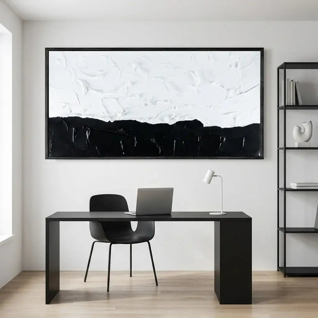 Modern office setup with a black desk, chair, and abstract artwork on the wall.