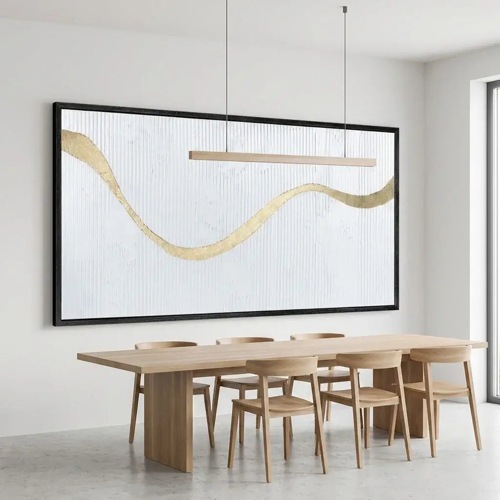 Modern dining room with wooden table and chairs, abstract wall art, and pendant light.