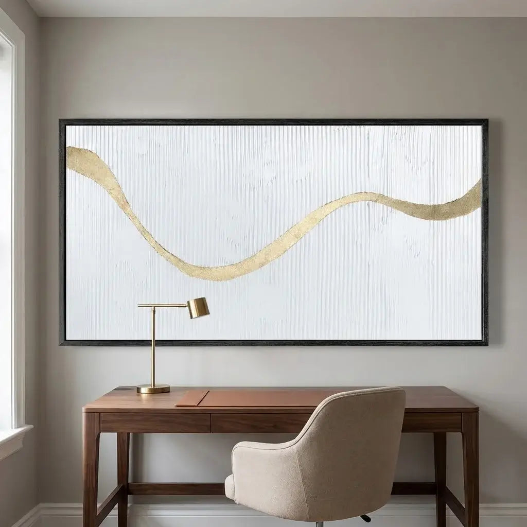 Modern office setup with a desk, chair, and abstract art on the wall.