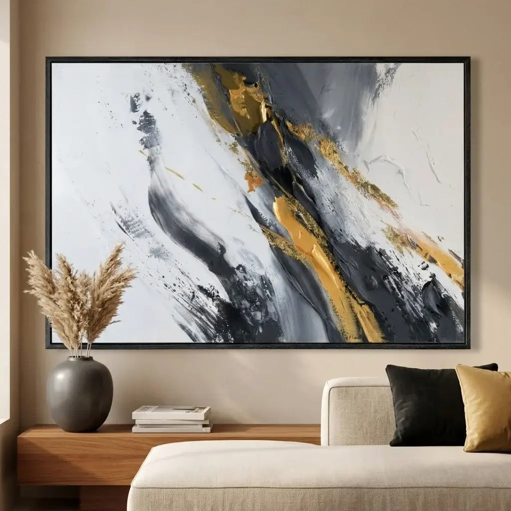 Abstract art piece with gold and black accents in a modern office setting.