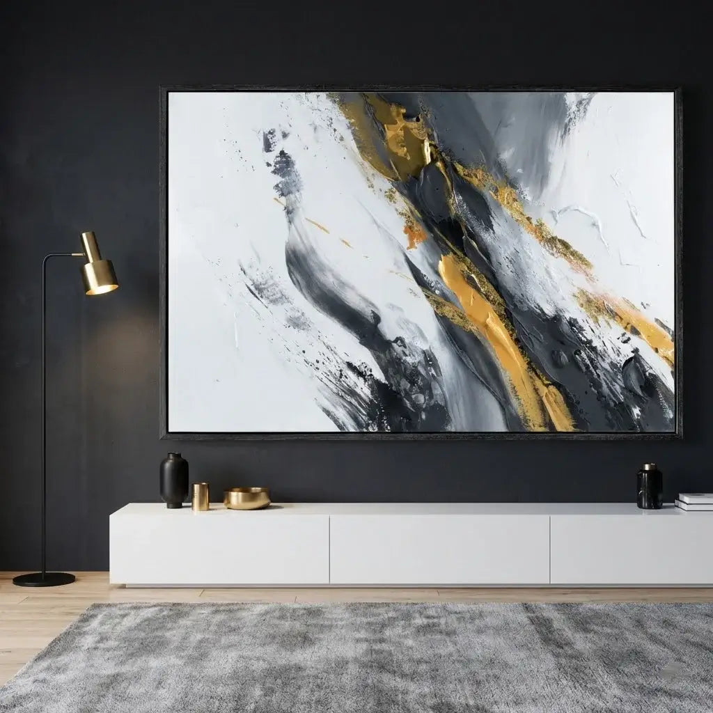 Abstract painting with gold and black accents on a dark wall above a white console table.
