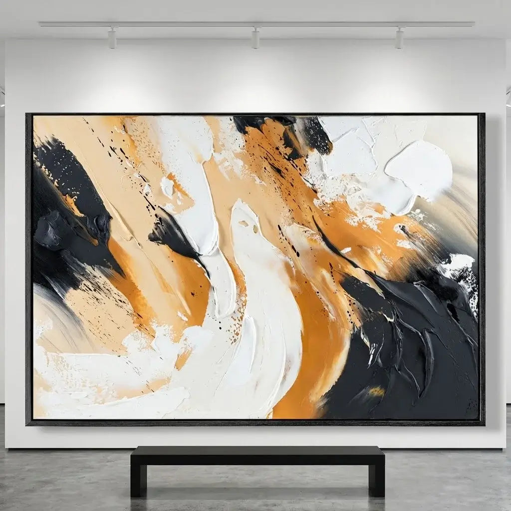 Abstract art painting with black, orange, and white colors on a gray wall.