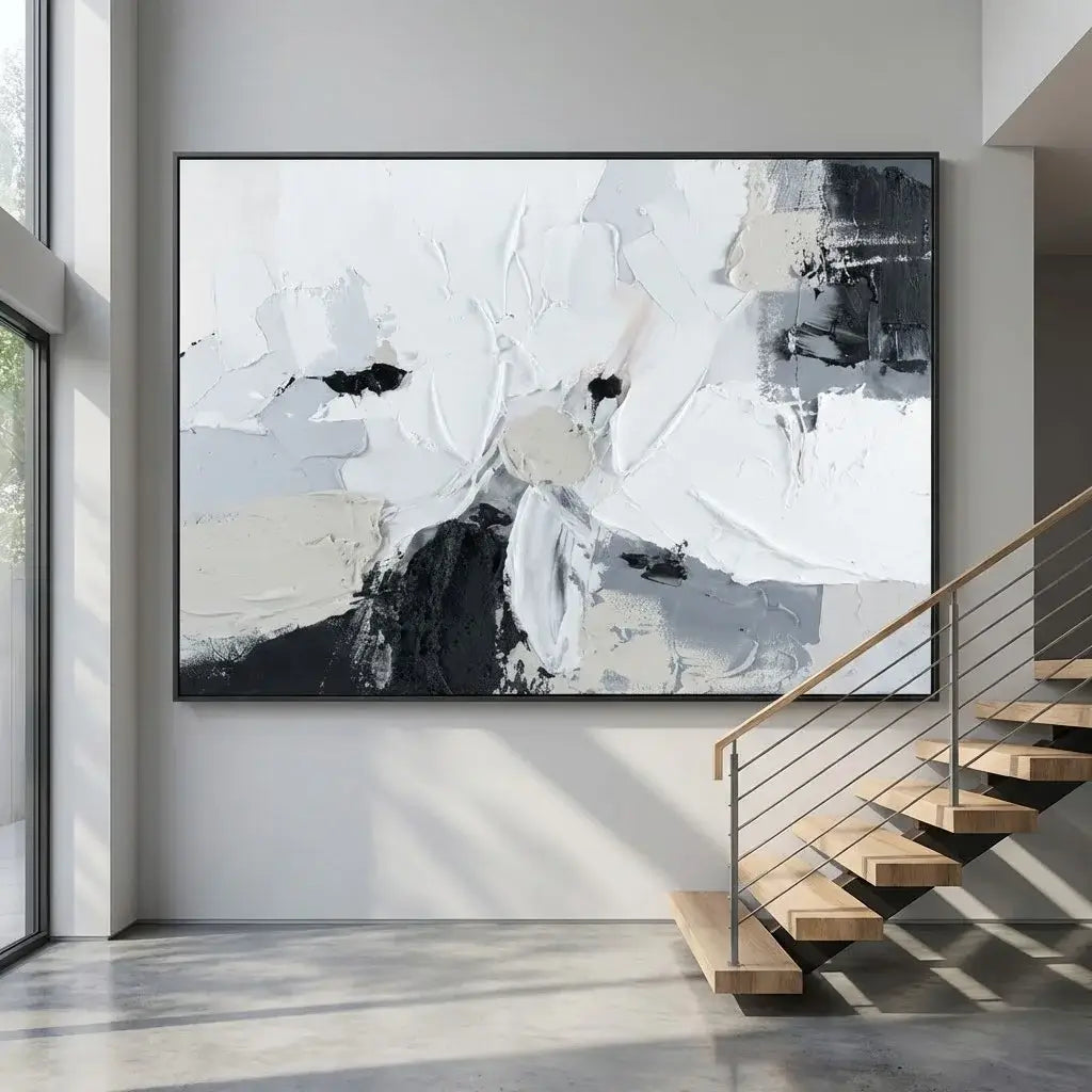 Abstract art piece in a modern interior setting with a staircase.