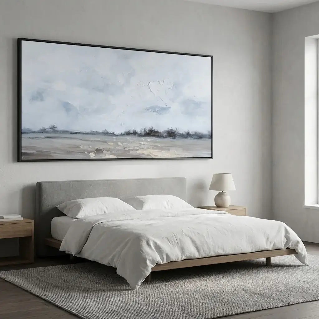 Modern bedroom with a bed, nightstands, and a large framed artwork on the wall.