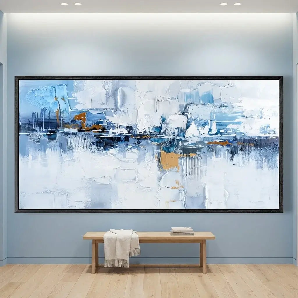 Abstract art painting on a wall with a wooden bench below in a room.