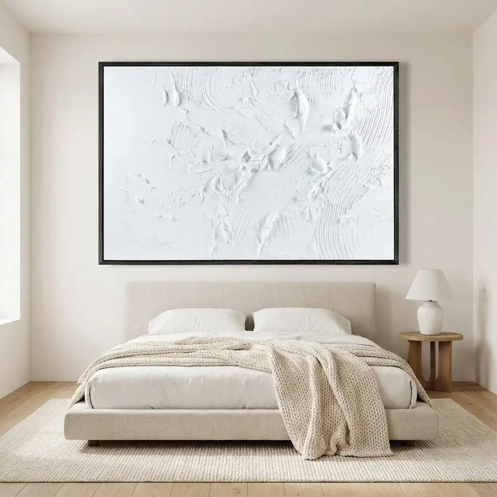 Beige bedroom with a large abstract painting on the wall