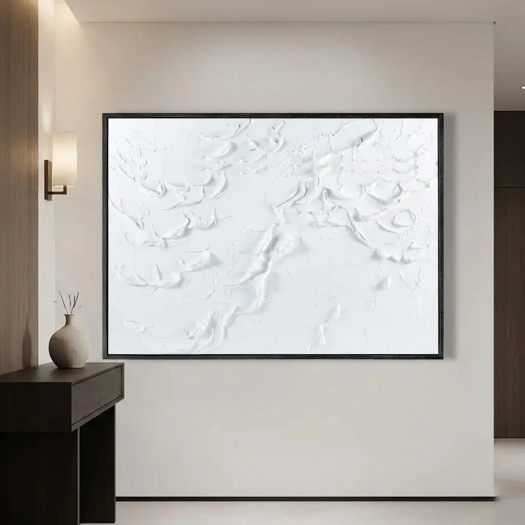 Abstract white painting on a wall in a modern interior setting