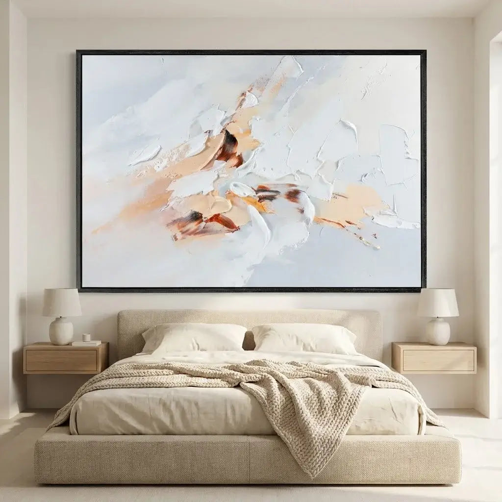 Abstract painting above a bed in a bedroom setting