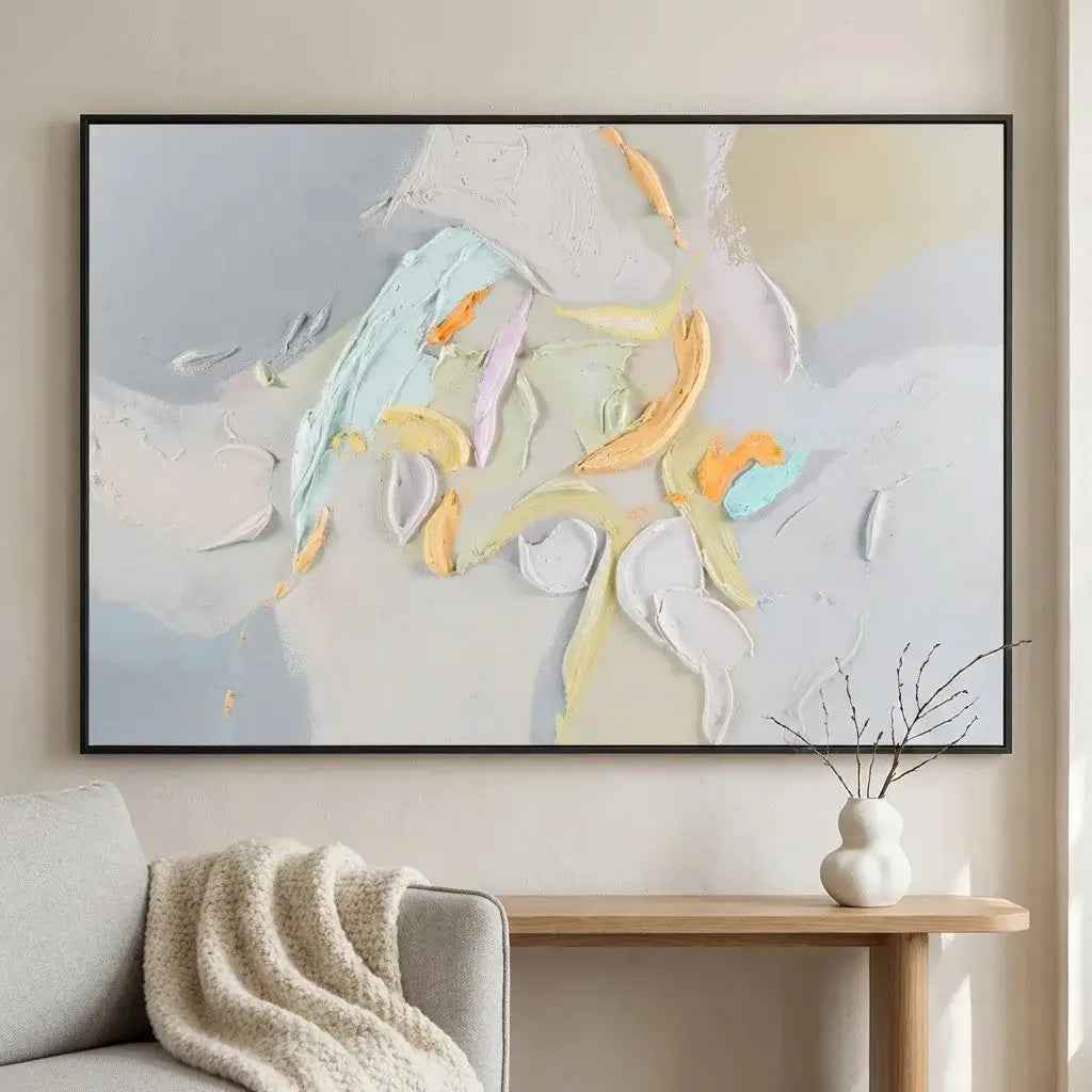 Abstract painting on a wall above a sofa in a living room