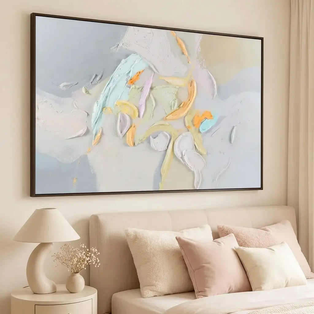 Abstract painting above a bed in a bedroom setting