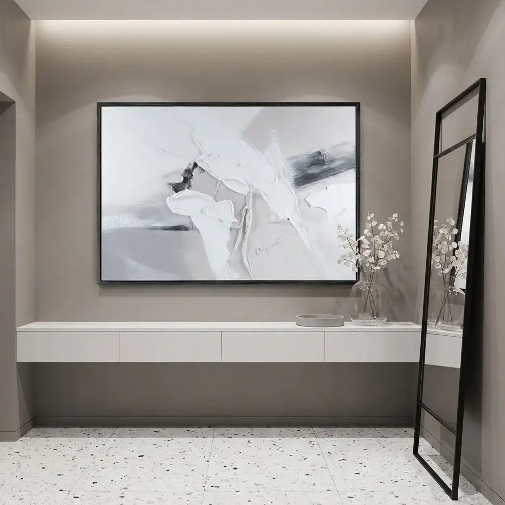 Modern interior with abstract art on the wall, a mirror, and decorative elements.