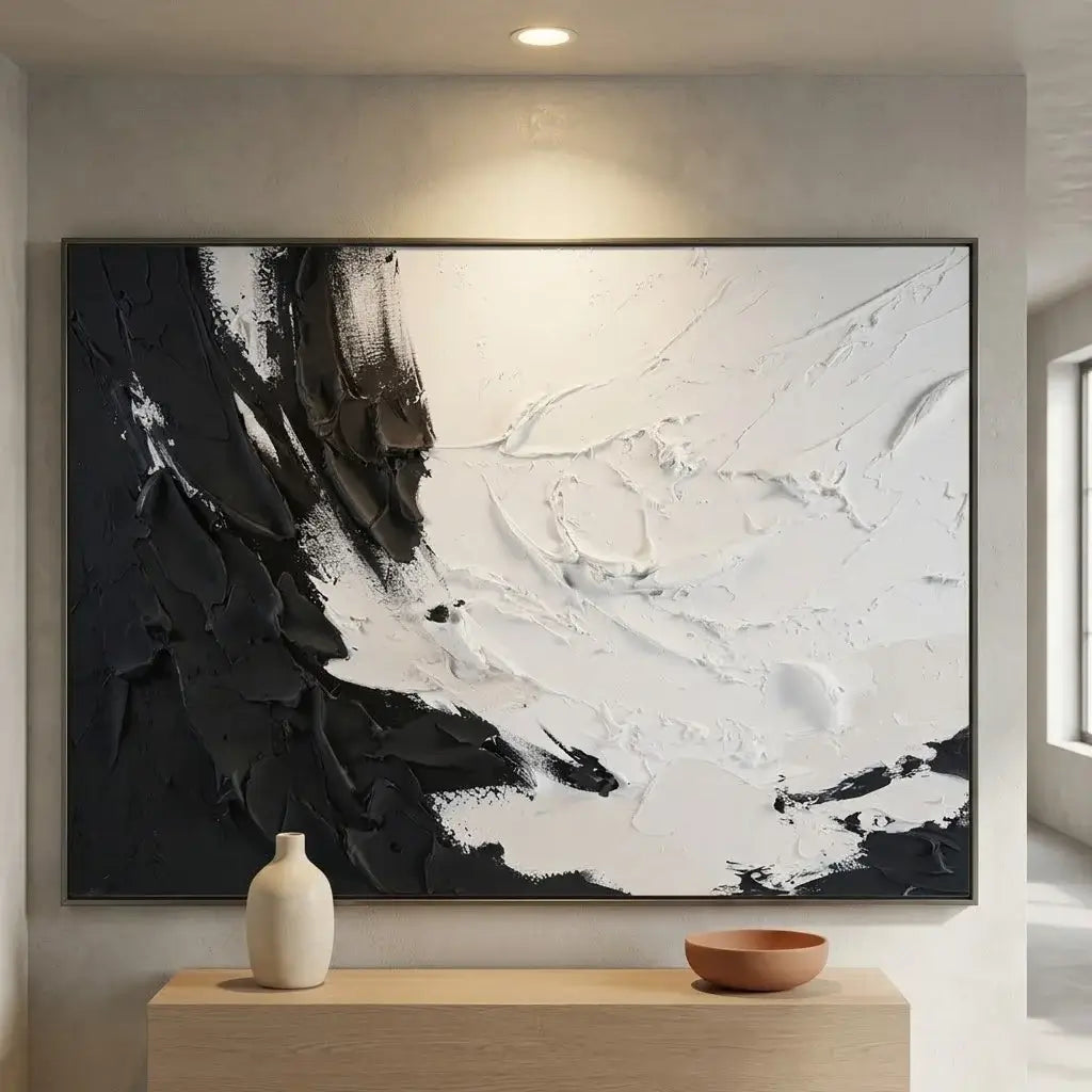 Modern interior with abstract black and white painting, console table, and coat rack.