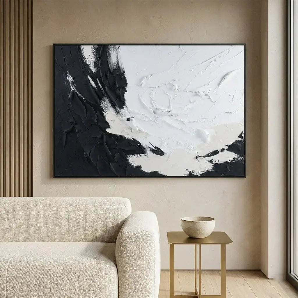 Modern interior with abstract art, round mirror, and console table.